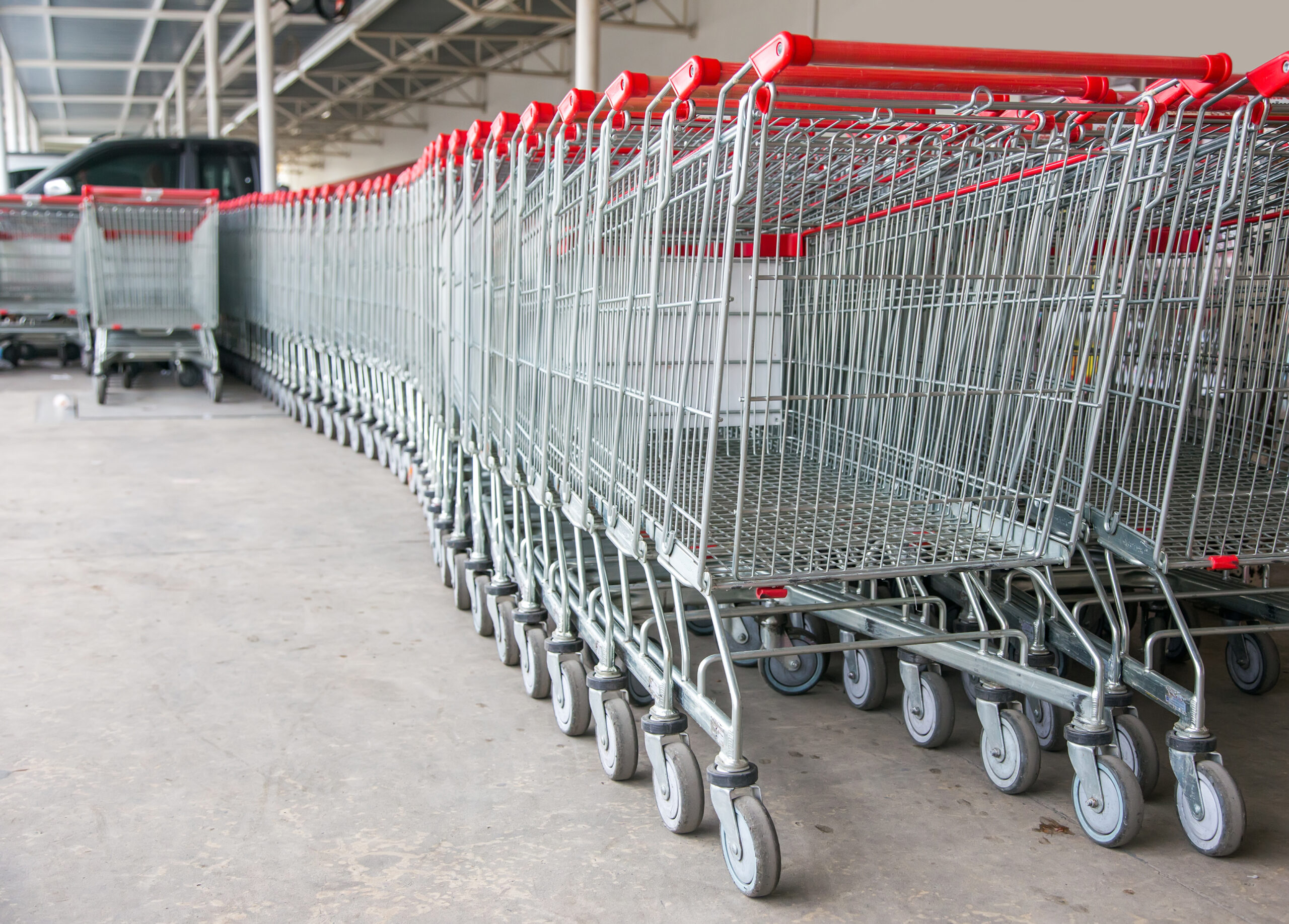 empty shopping trolley cart in supermarket cause shopping online and e-commurce is new normal of customer behavior